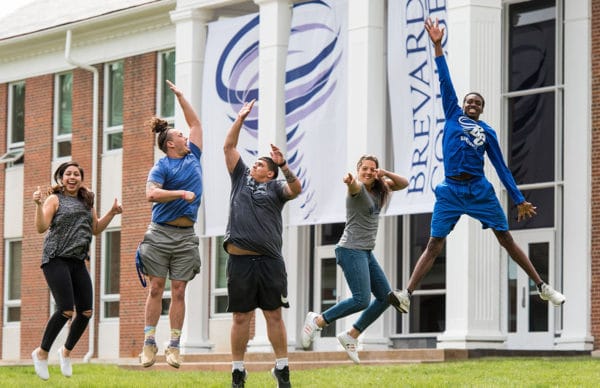 Students jumping in the Brevard College academic quad