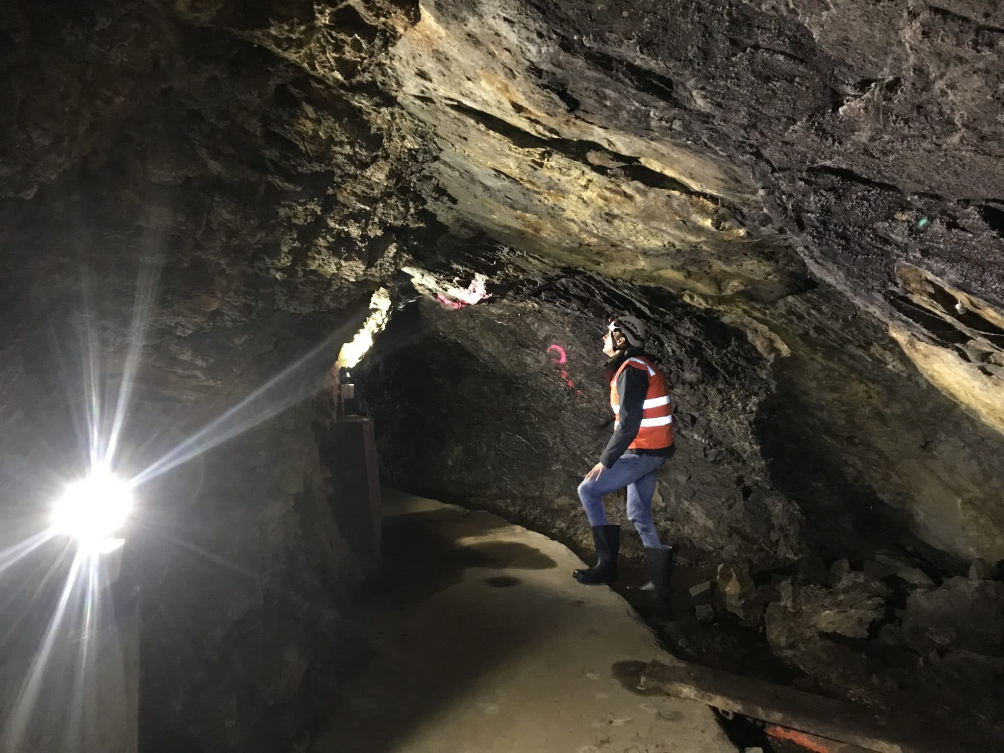 Jowsey examining rock fractures in a tunnel in Waipori in the South Island in New Zealand